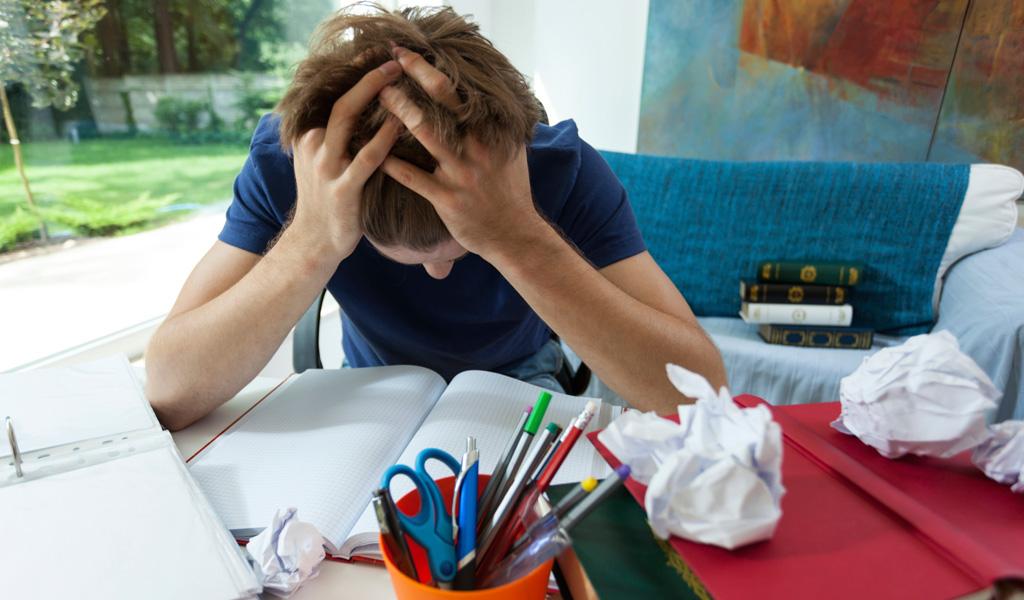 Stop Forgetting Tasks With a Simple Digital System 2 A man frustrating and put his head on a messy table